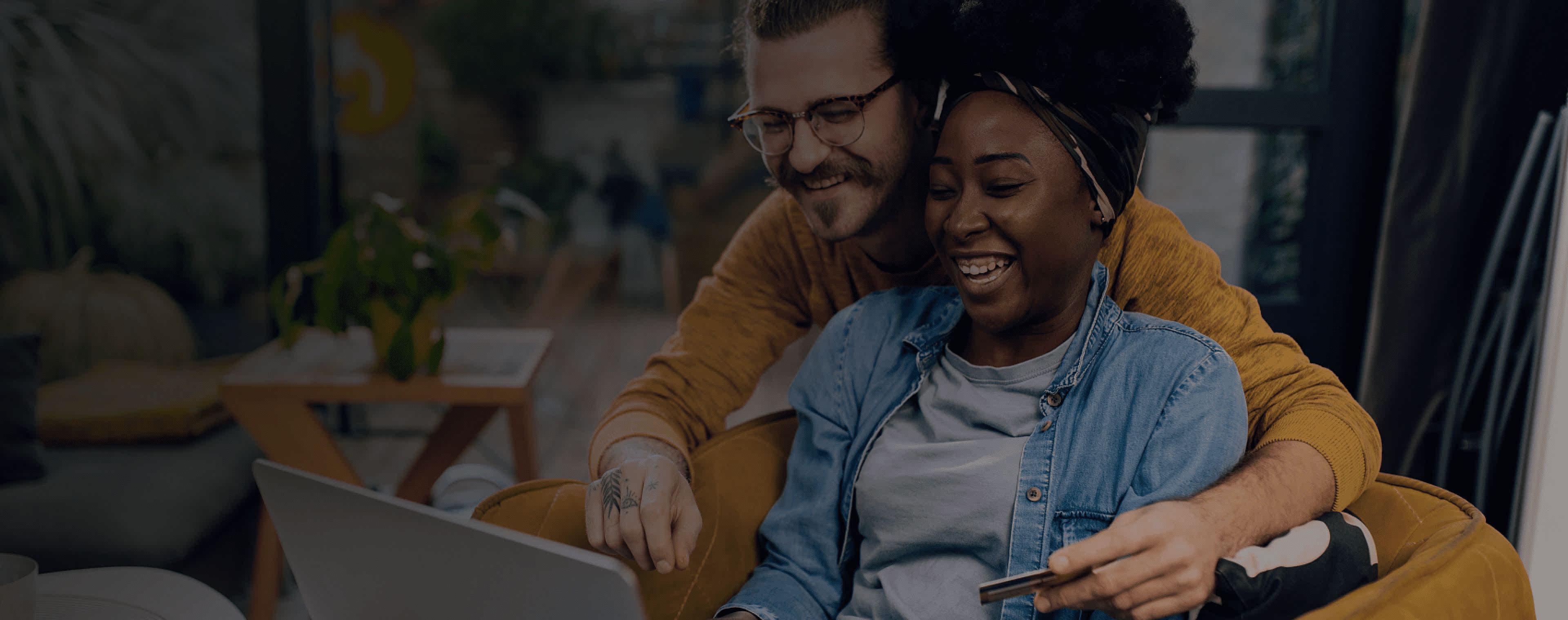 Couple using laptop